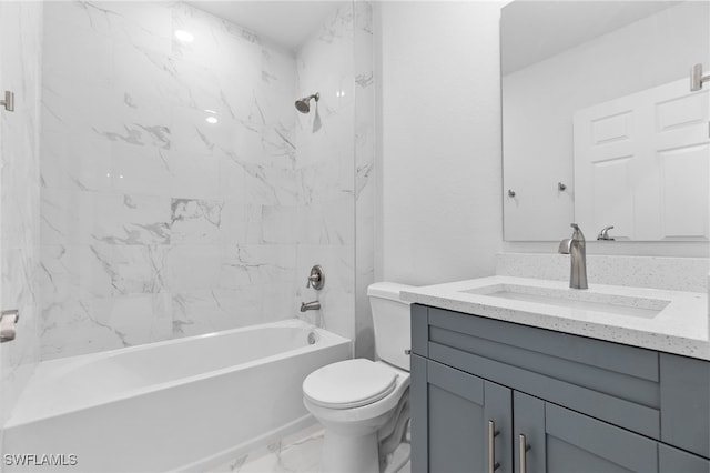 full bathroom featuring tiled shower / bath combo, toilet, and vanity