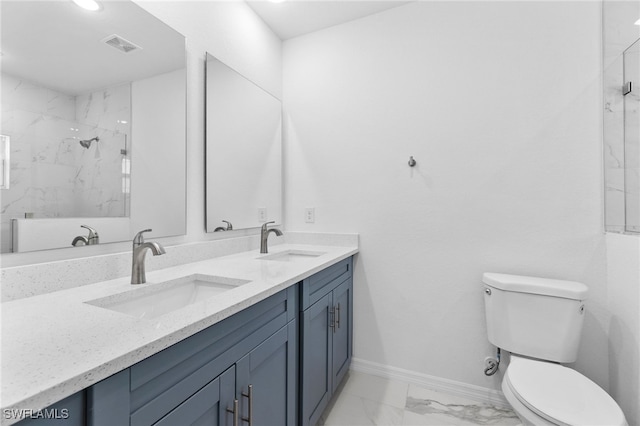 bathroom featuring vanity, toilet, and walk in shower