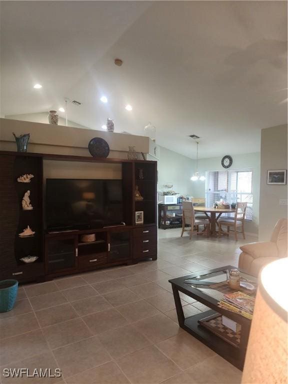 tiled living room with lofted ceiling