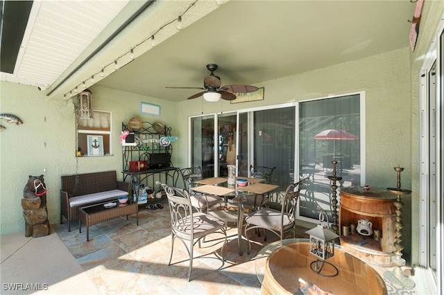 view of patio featuring ceiling fan