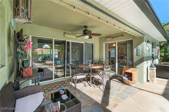 view of patio featuring ceiling fan