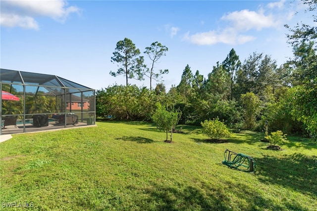 view of yard featuring a lanai