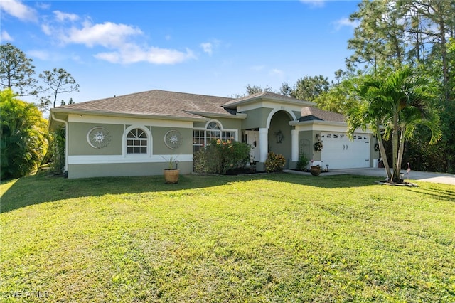 view of front facade with a front lawn and a garage