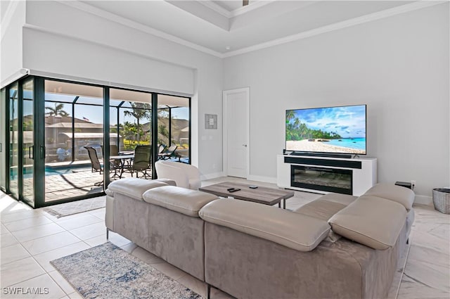 living room with crown molding and a high ceiling