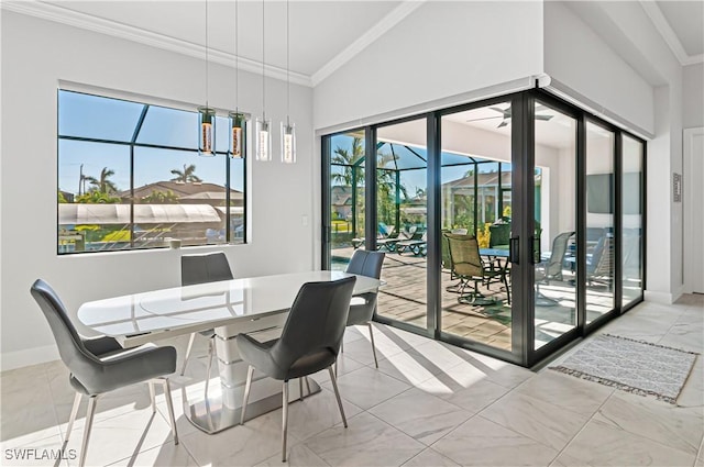 dining area featuring vaulted ceiling and ornamental molding