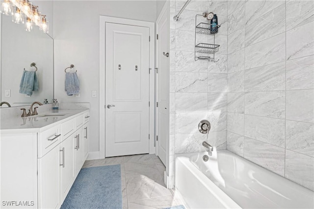 bathroom with vanity and tiled shower / bath combo