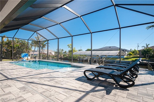 view of pool featuring a lanai and a patio