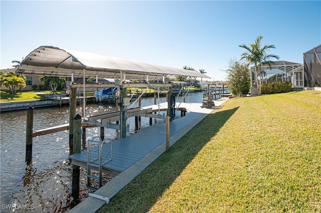 dock area featuring a water view and a yard