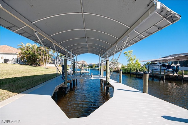 dock area featuring a yard and a water view