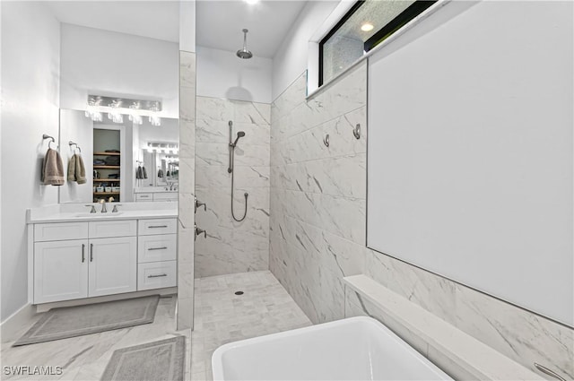 bathroom with vanity and independent shower and bath