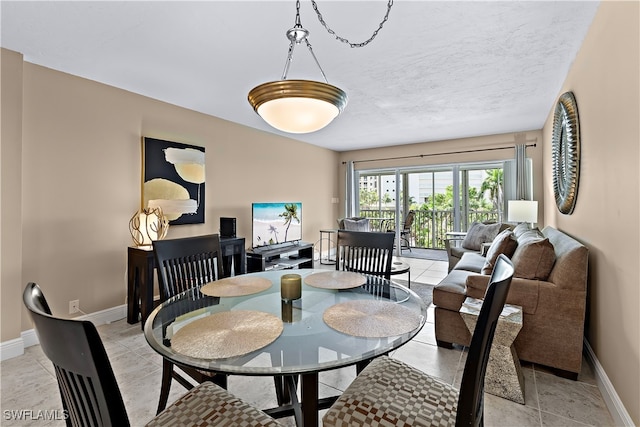 1 Bluebill Ave Unit 409, Naples, FL 34108 - dining area with baseboards