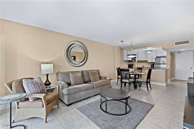 living room with light tile patterned flooring