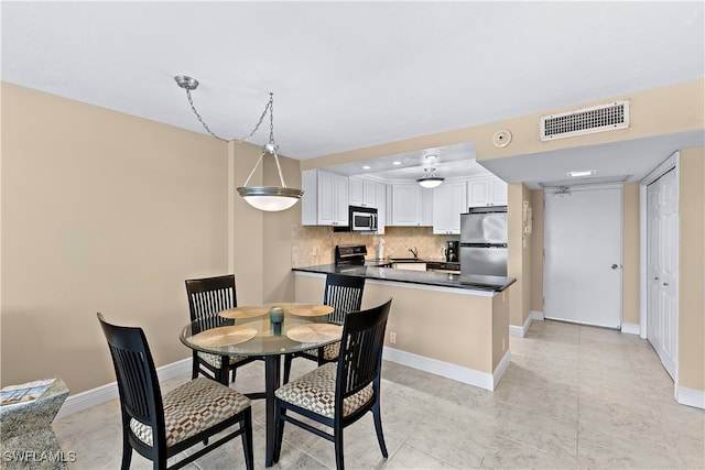 dining room with light tile patterned floors