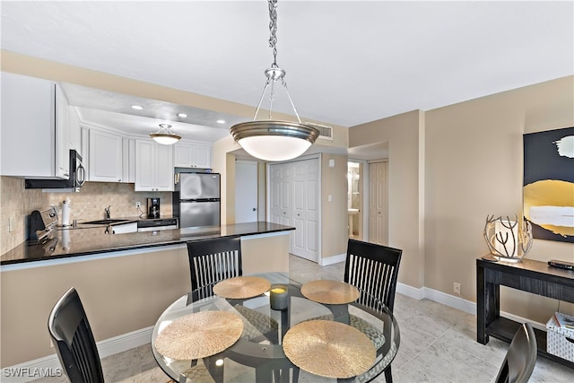 dining area with light tile patterned floors