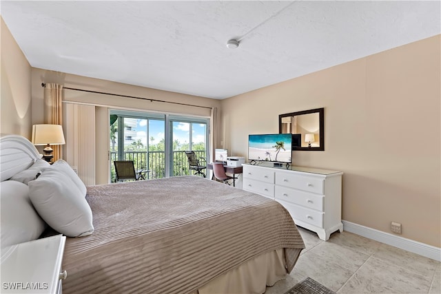 tiled bedroom featuring access to exterior