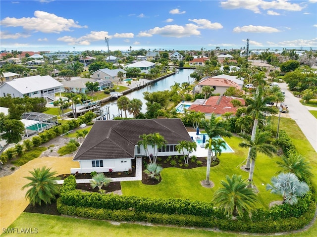 birds eye view of property featuring a water view