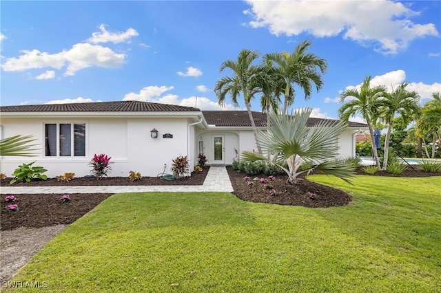 view of front of property with a front lawn