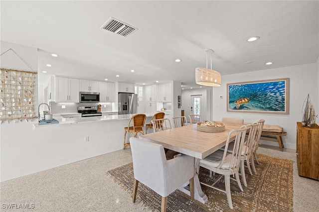 dining area featuring sink