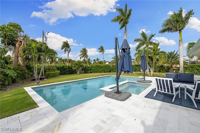 view of pool featuring a yard, an in ground hot tub, and a patio