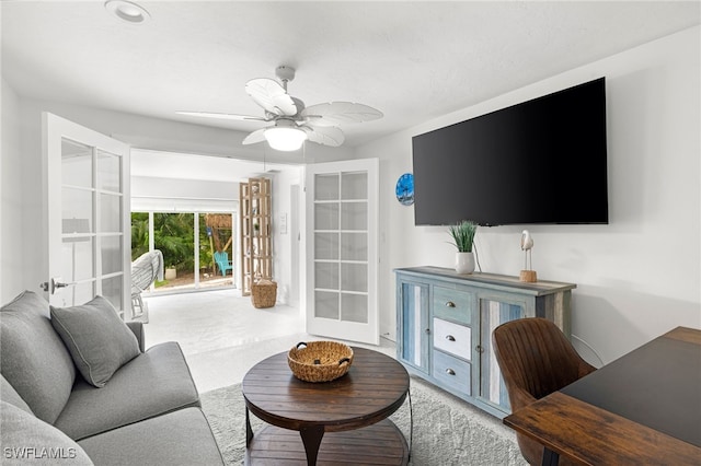 living room with ceiling fan and french doors