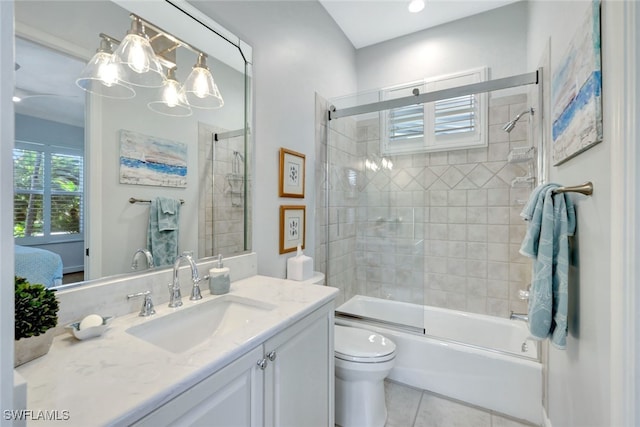 full bathroom with tile patterned floors, shower / bath combination with glass door, vanity, and toilet