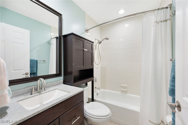 full bathroom with shower / bath combo with shower curtain, vanity, and toilet