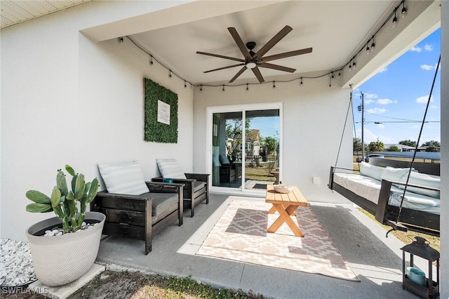 view of patio / terrace featuring ceiling fan