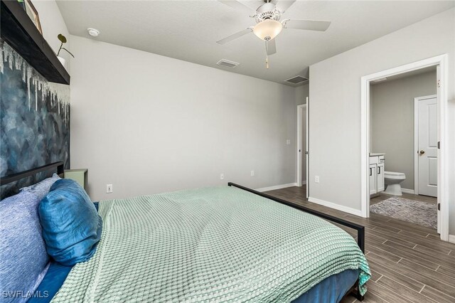 bedroom featuring ensuite bath and ceiling fan