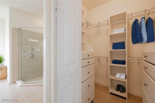 walk in closet featuring light tile patterned floors