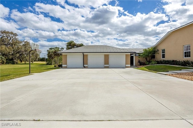 view of home's exterior with a lawn and a garage