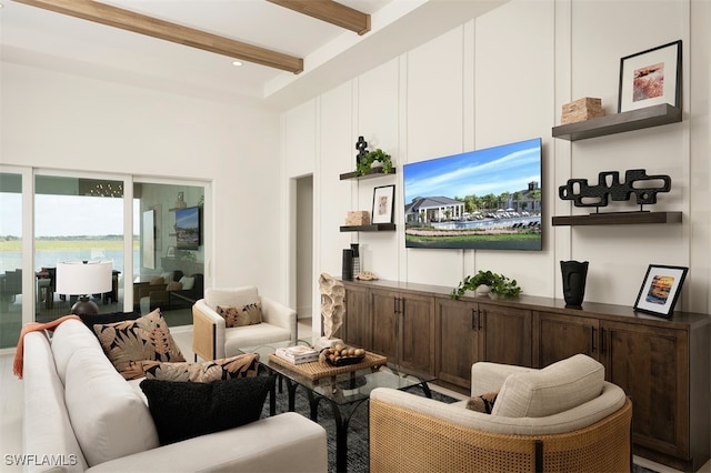 living area with a water view, a towering ceiling, beam ceiling, and recessed lighting