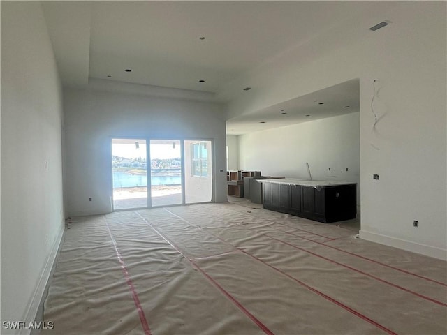 spare room featuring a high ceiling