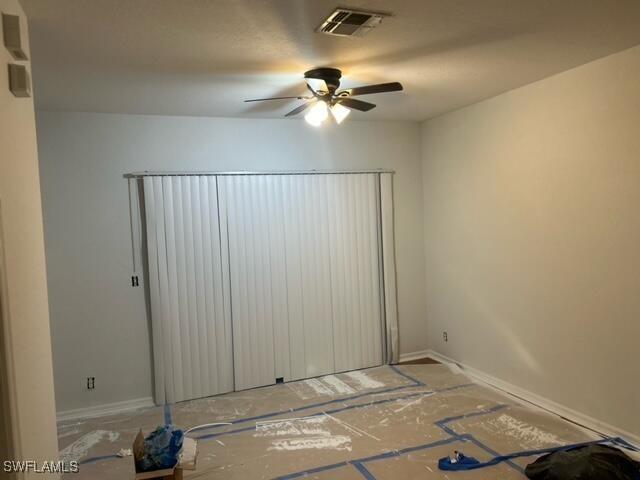 empty room featuring ceiling fan