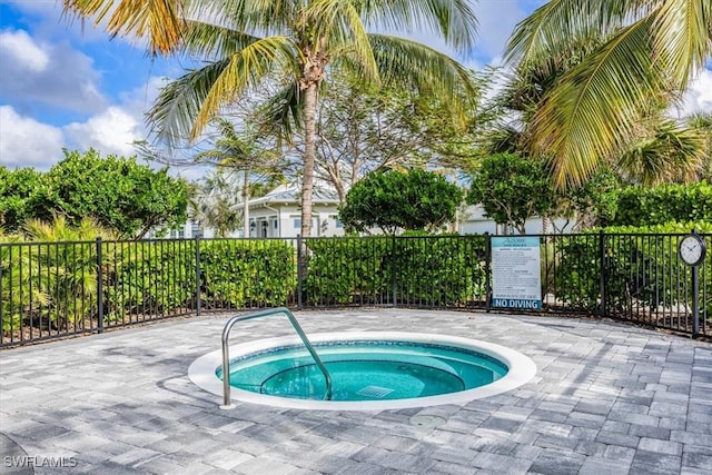 view of pool with a community hot tub