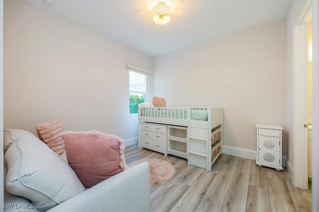 bedroom with light hardwood / wood-style flooring