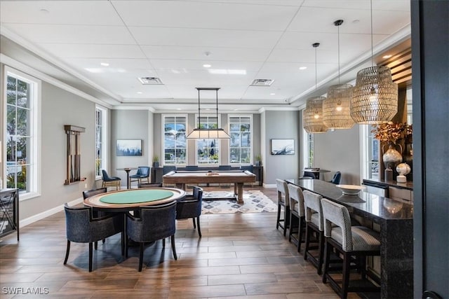 playroom with crown molding, dark hardwood / wood-style flooring, a healthy amount of sunlight, and billiards