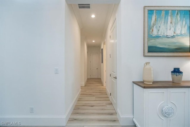 corridor featuring light hardwood / wood-style floors