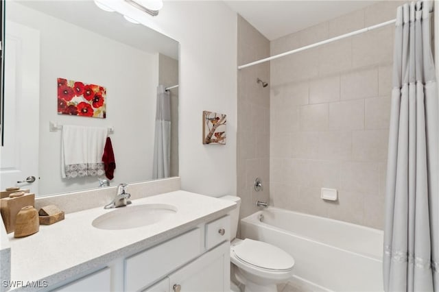 full bathroom featuring vanity, shower / bath combo, and toilet