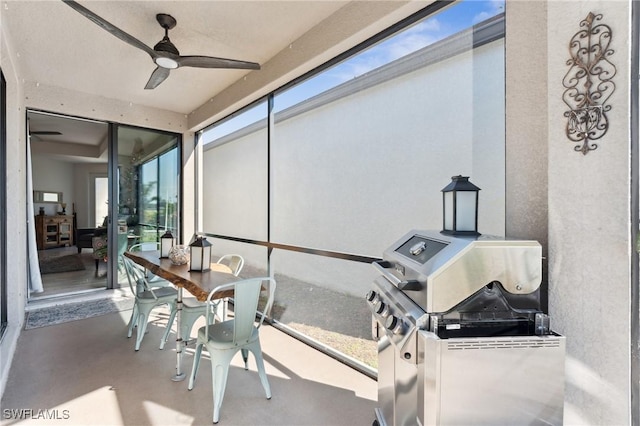 sunroom / solarium featuring ceiling fan