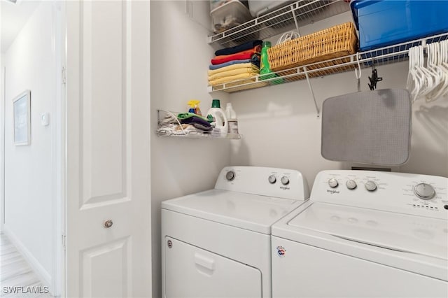 washroom featuring washing machine and clothes dryer