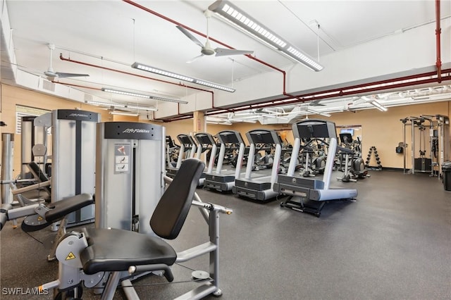 exercise room with ceiling fan