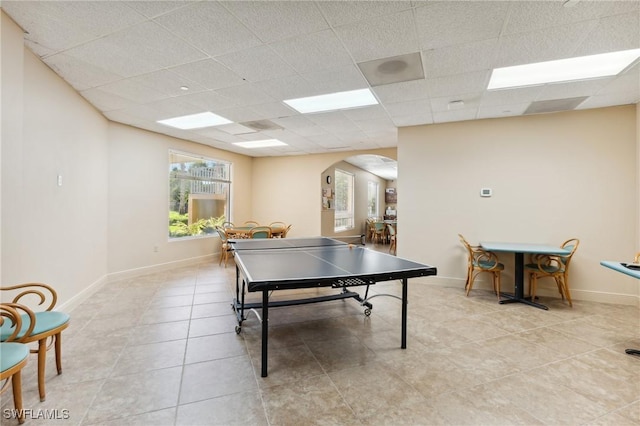 game room featuring light tile patterned floors and a drop ceiling