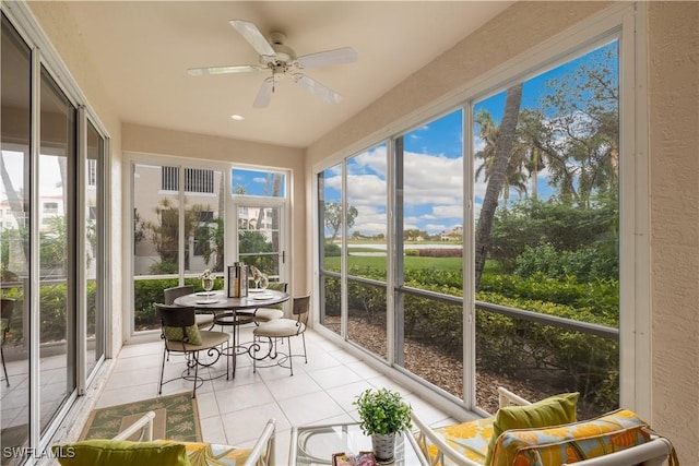 sunroom with ceiling fan and a healthy amount of sunlight