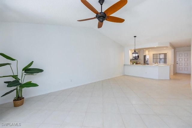 unfurnished living room featuring lofted ceiling and ceiling fan