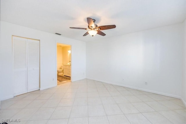 unfurnished bedroom with a ceiling fan, a closet, visible vents, and baseboards