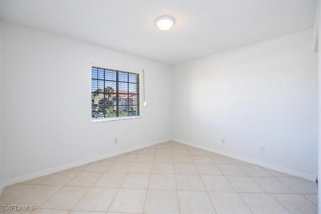 empty room with baseboards