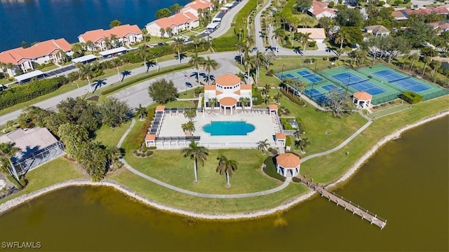 birds eye view of property featuring a water view and a residential view