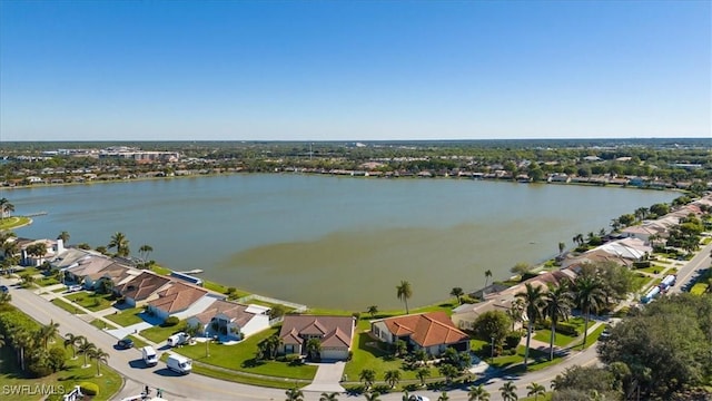 birds eye view of property with a water view and a residential view