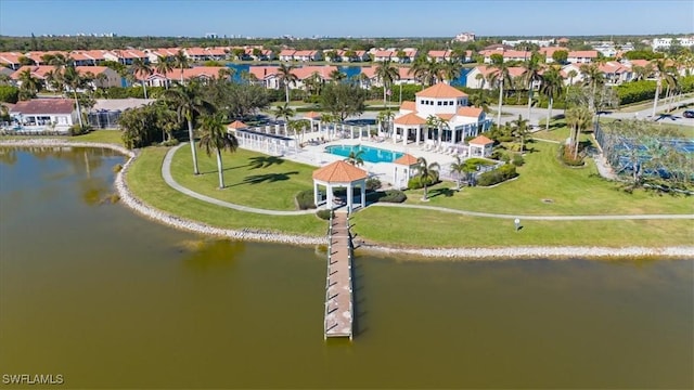 drone / aerial view featuring a water view and a residential view