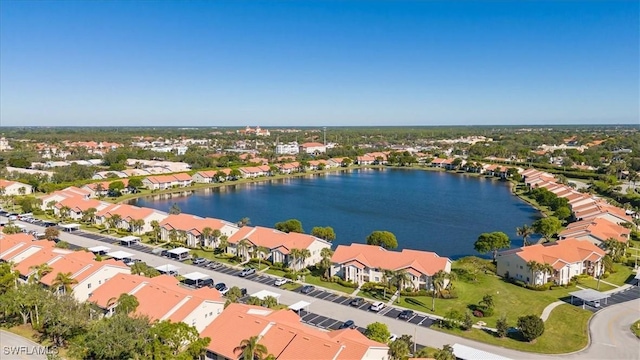 birds eye view of property with a water view and a residential view